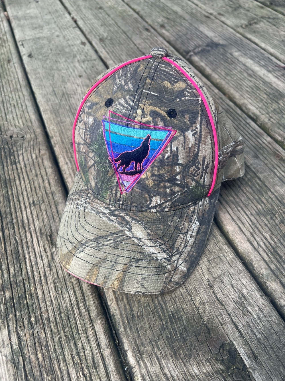 Realtree Camo Baseball Cap with Pink Piping and Blue Wolf Patch
